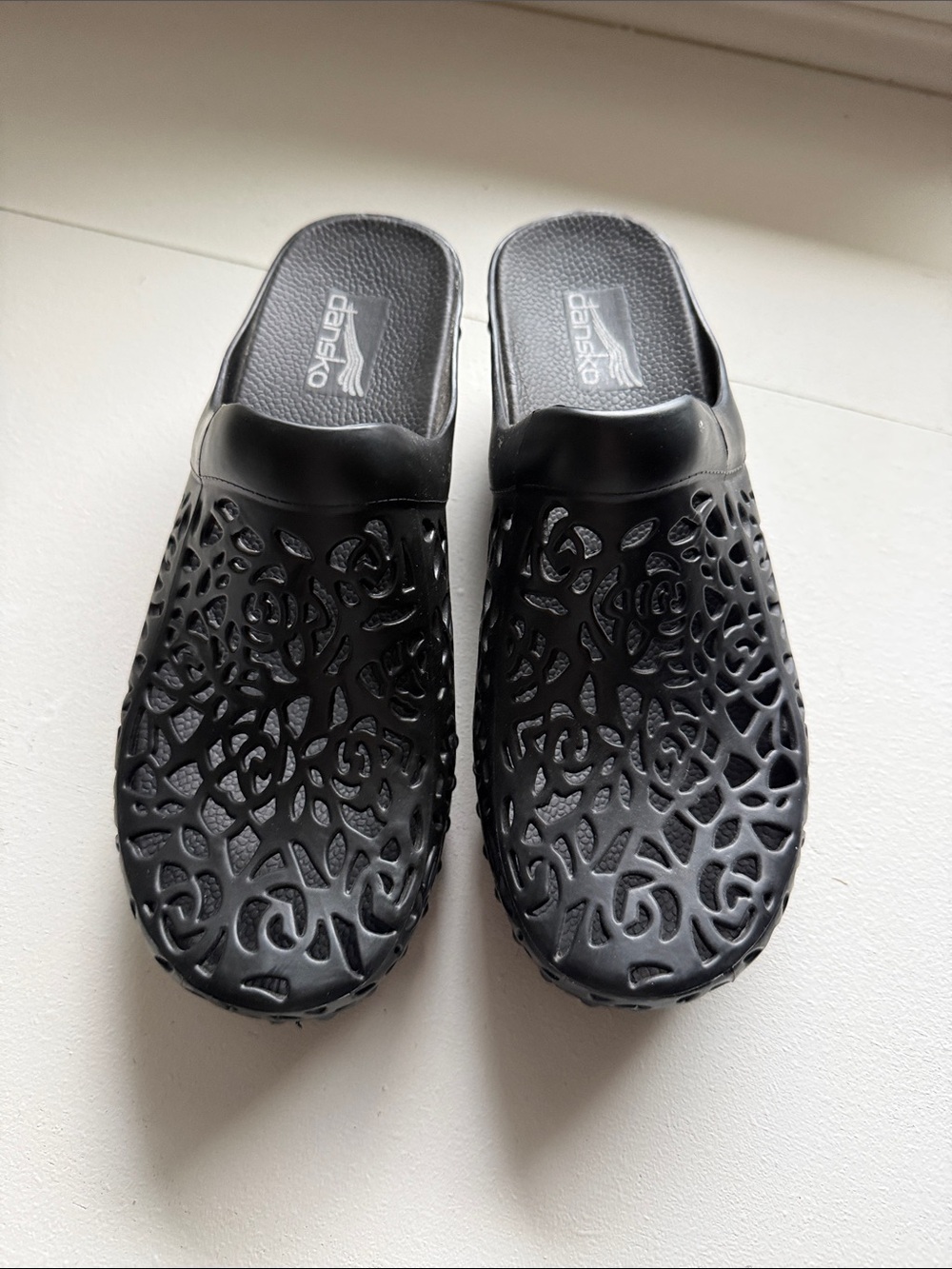 Dansko Black Laser-Cut Garden-Style Slip-Ons